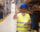 demo-attachment-902-warehouse-worker-standing-large-storage-center-showing-ok-hand-gesture-satisfied-delivering-goods